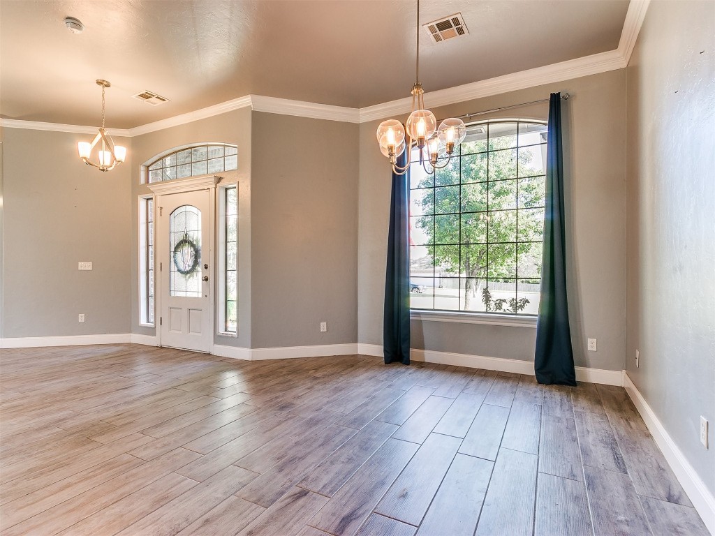 916 Hunters Pointe Road, Edmond, OK 73003 unfurnished room with carpet floors and ceiling fan