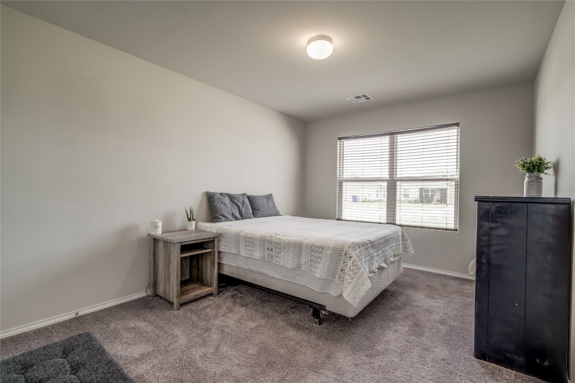 633 W Ava Drive, Mustang, OK 73064 bedroom featuring carpet floors