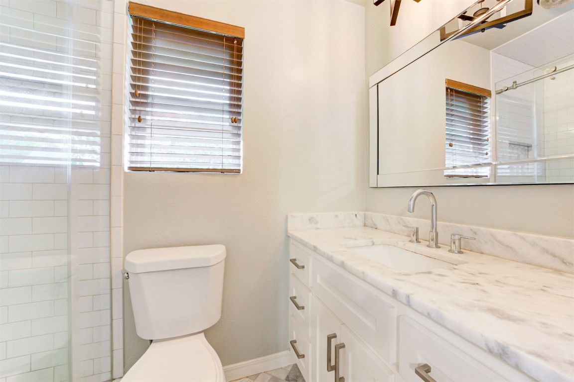 2509 NW 58th Street, Oklahoma City, OK 73112 bathroom with vanity and toilet