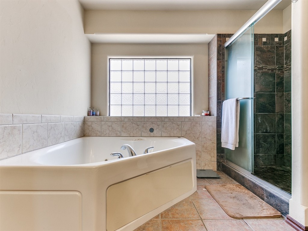 17001 Kemble Lane, Edmond, OK 73012 bathroom featuring tile flooring and separate shower and tub