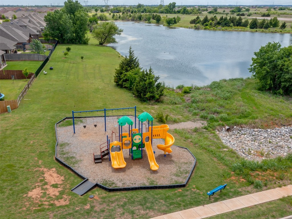 9117 NW 139th Street, Yukon, OK 73099 view of playground with a water view