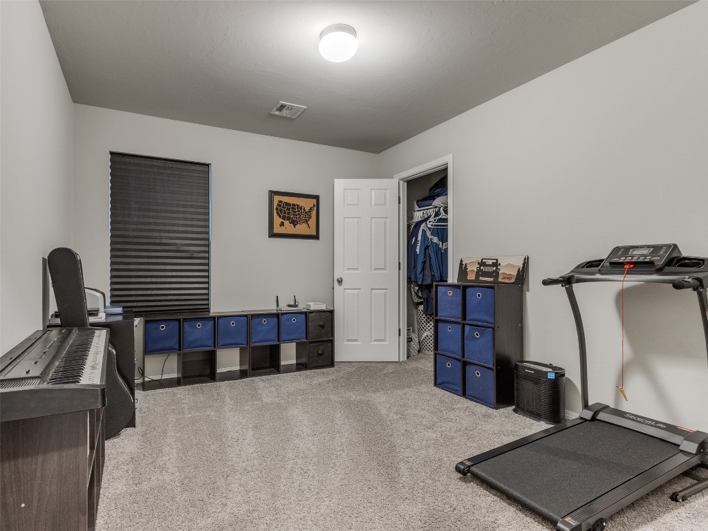 3829 Palio Lane, Oklahoma City, OK 73179 workout room featuring carpet flooring