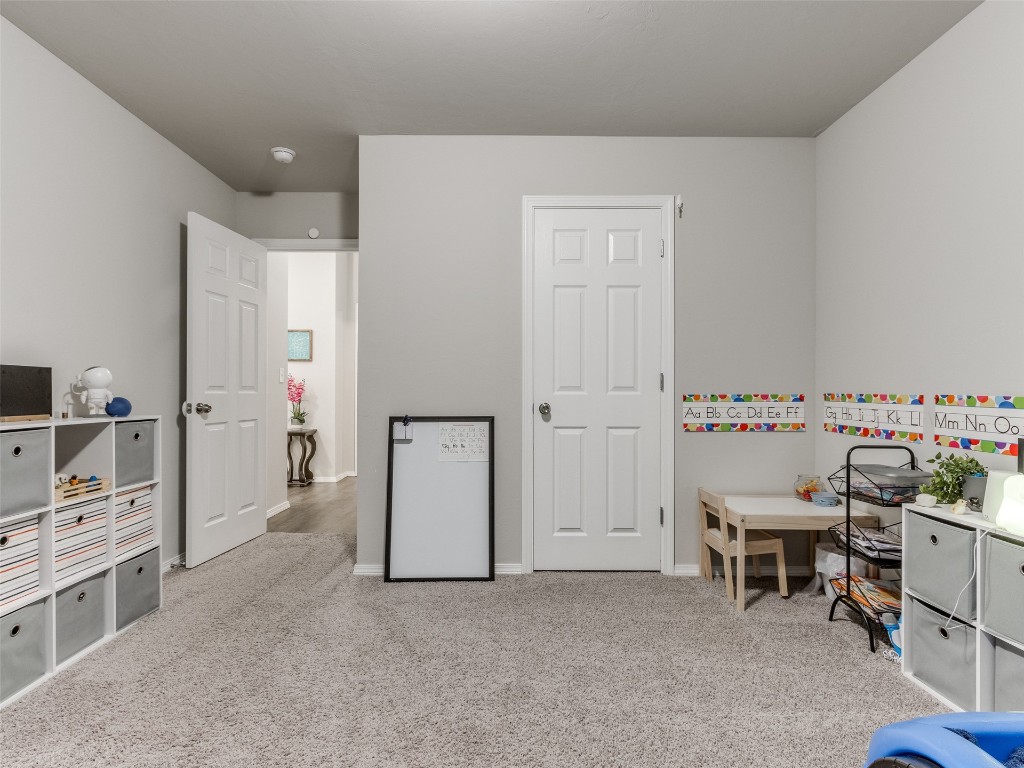 3829 Palio Lane, Oklahoma City, OK 73179 playroom with light colored carpet