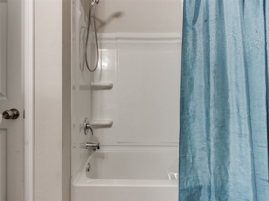 3829 Palio Lane, Oklahoma City, OK 73179 bathroom featuring shower / bath combo with shower curtain