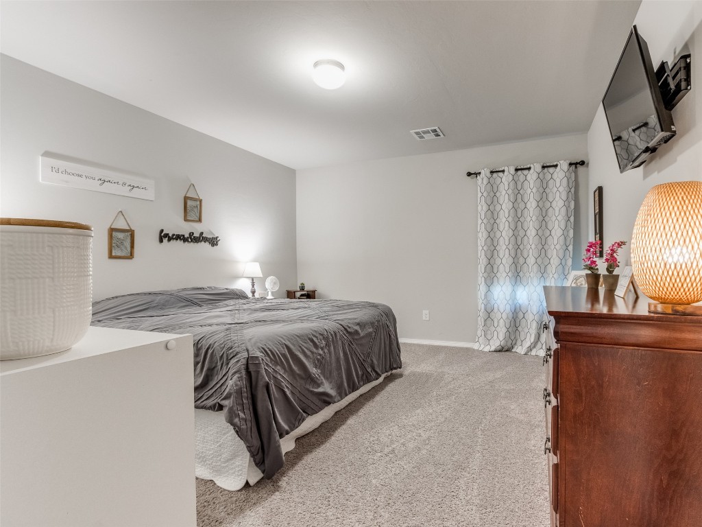 3829 Palio Lane, Oklahoma City, OK 73179 bedroom featuring carpet flooring