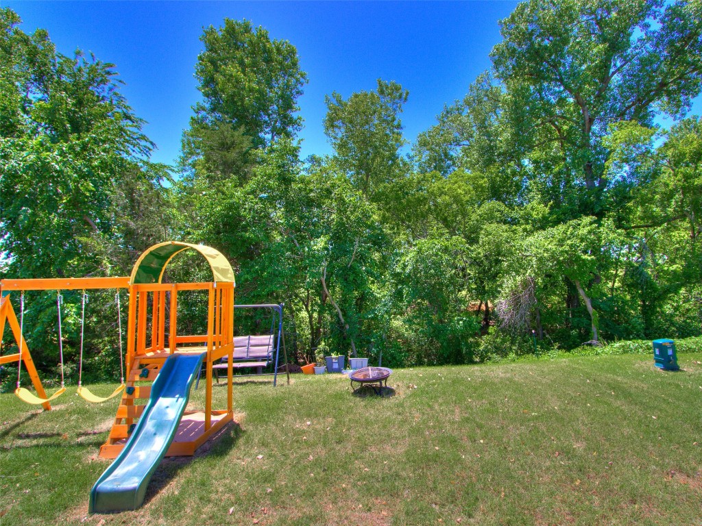 3829 Palio Lane, Oklahoma City, OK 73179 view of playground featuring a lawn