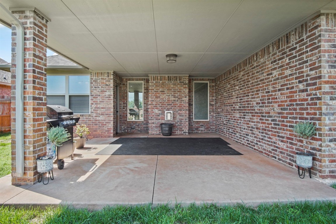 3405 NW 164th Street, Edmond, OK 73013 view of patio with a grill