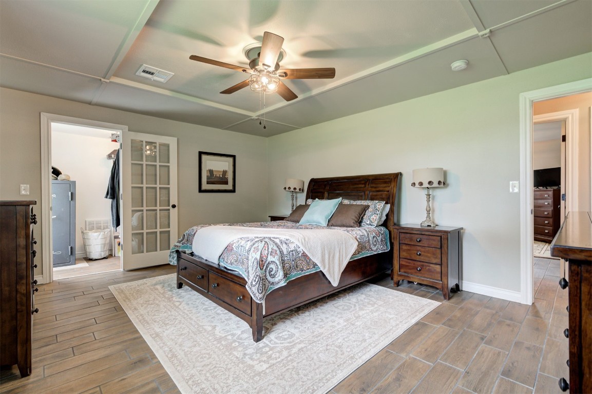 10315 E Post Oak Road, Noble, OK 73068 bedroom featuring hardwood / wood-style flooring and ceiling fan