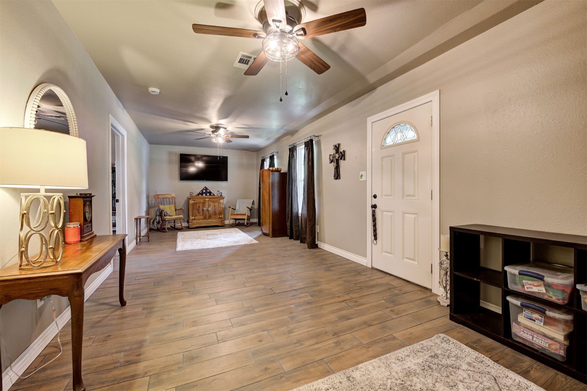 10315 E Post Oak Road, Noble, OK 73068 entrance foyer with ceiling fan and hardwood / wood-style flooring