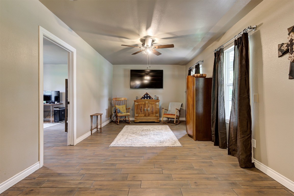 10315 E Post Oak Road, Noble, OK 73068 interior space featuring hardwood / wood-style floors and ceiling fan