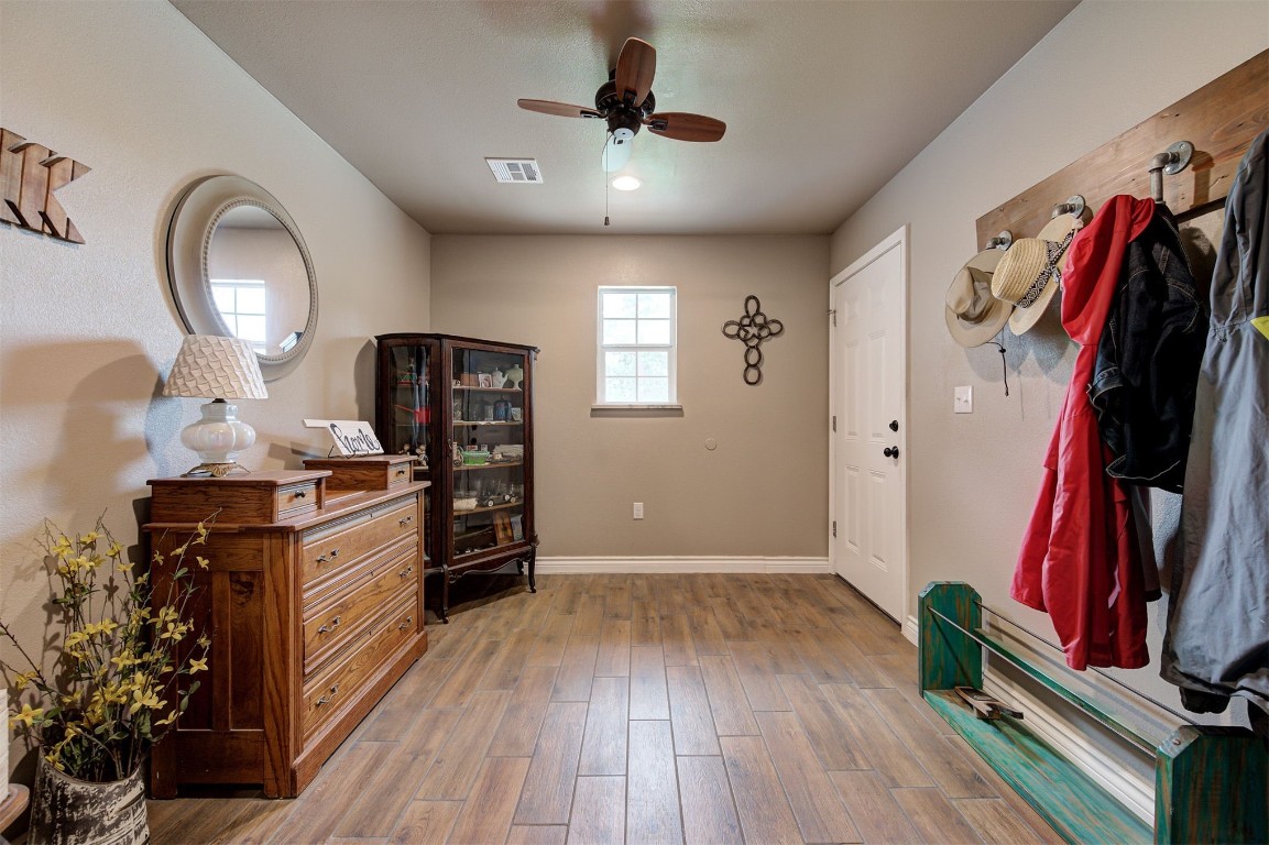 10315 E Post Oak Road, Noble, OK 73068 entryway featuring ceiling fan and hardwood / wood-style floors