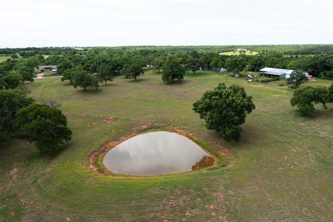 10315 E Post Oak Road, Noble, OK 73068 aerial view with a water view and a rural view
