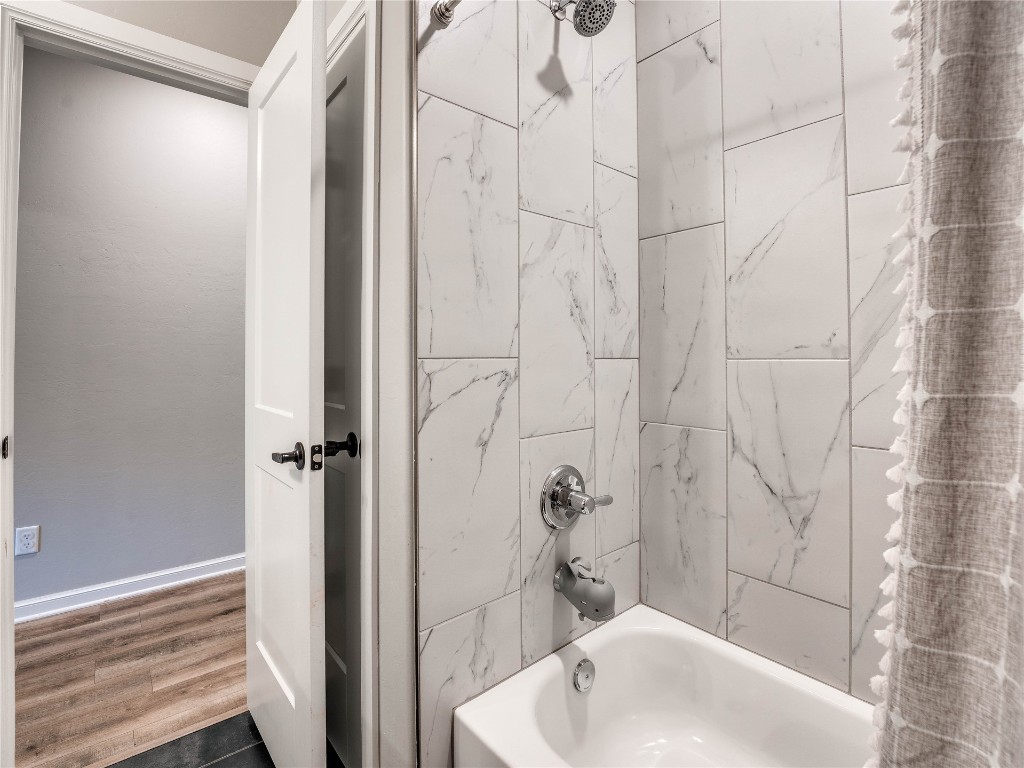 18725 Big Cedar Way, Edmond, OK 73012 bathroom with hardwood / wood-style floors and shower / bath combination with curtain