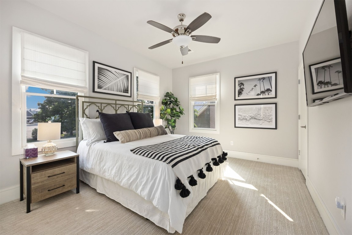 53 Boardwalk Street, Carlton Landing, OK 74432 bedroom with ceiling fan, light carpet, and multiple windows