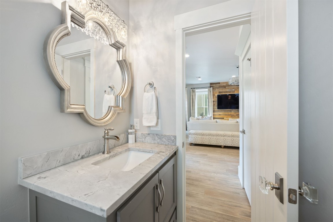 53 Boardwalk Street, Carlton Landing, OK 74432 bathroom with vanity and hardwood / wood-style floors