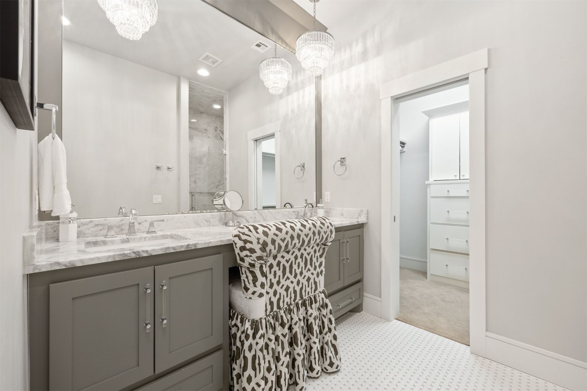 53 Boardwalk Street, Carlton Landing, OK 74432 bathroom featuring tile flooring, a notable chandelier, and large vanity