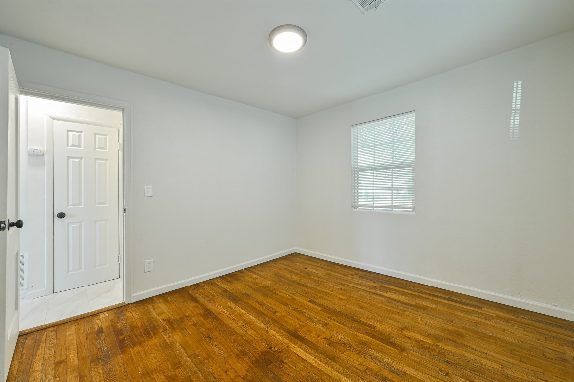 3013 SW 28th Street, Oklahoma City, OK 73108 empty room featuring dark hardwood / wood-style floors