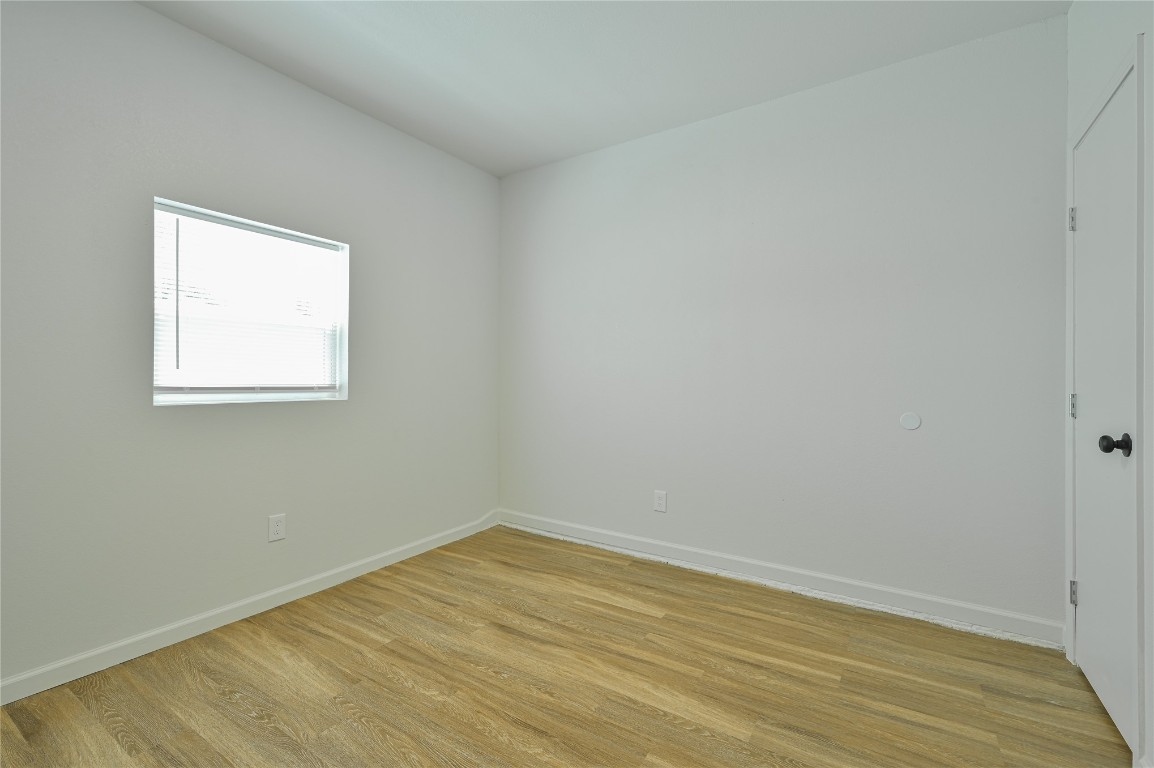 3013 SW 28th Street, Oklahoma City, OK 73108 unfurnished room with light hardwood / wood-style floors