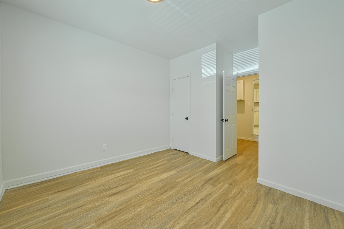 3013 SW 28th Street, Oklahoma City, OK 73108 spare room featuring light wood-type flooring