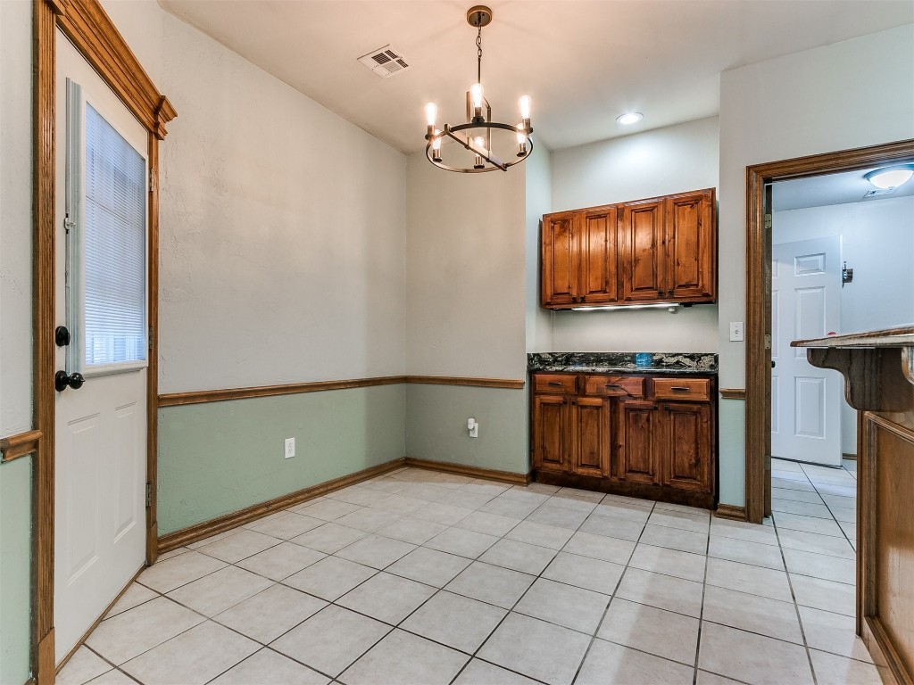 1400 NW 9th Street, Moore, OK 73170 kitchen with a notable chandelier, pendant lighting, and light tile floors