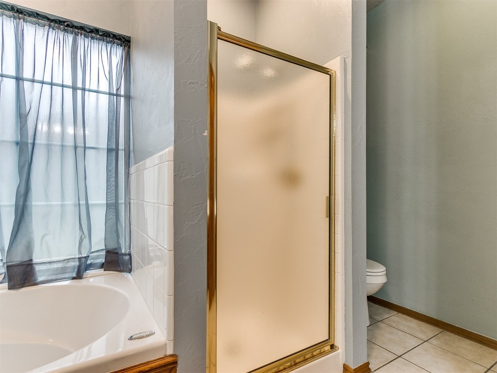 1400 NW 9th Street, Moore, OK 73170 bathroom with tile flooring, shower with separate bathtub, and toilet