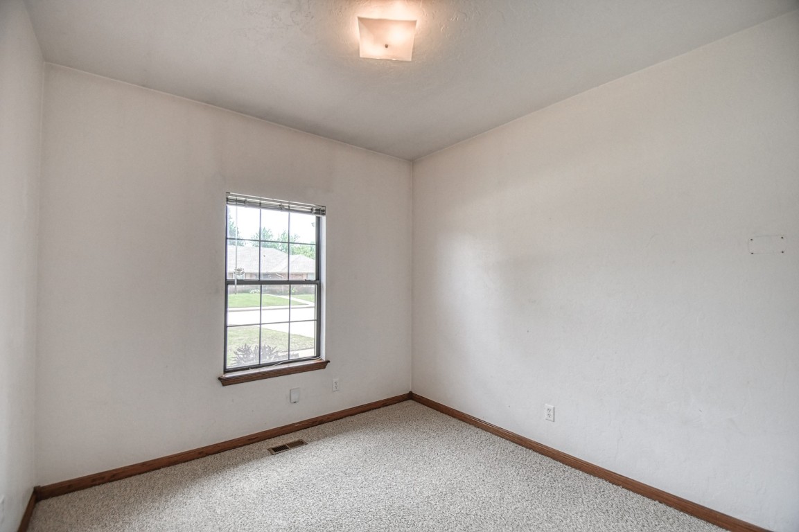 1725 Ryan Way, Edmond, OK 73003 empty room with carpet