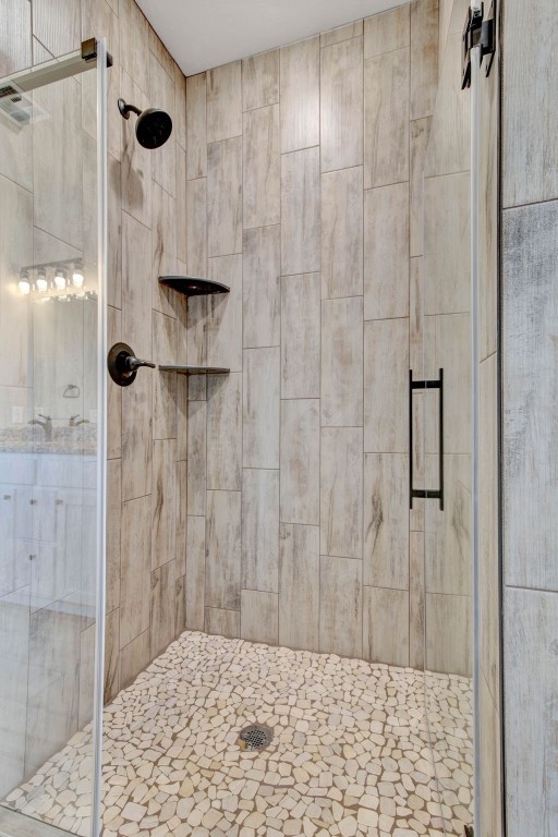 2105 Valley View, Weatherford, OK 73096 bathroom featuring a shower with shower door