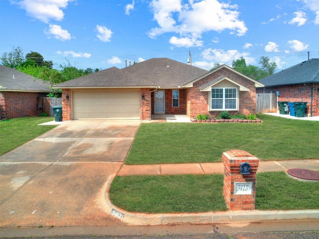 9413 Apple Drive, Midwest City, OK 73130 back of property with a yard and a patio area