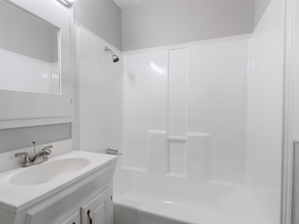 2836 Hillcrest Avenue, Moore, OK 73160 bathroom with shower / washtub combination and oversized vanity
