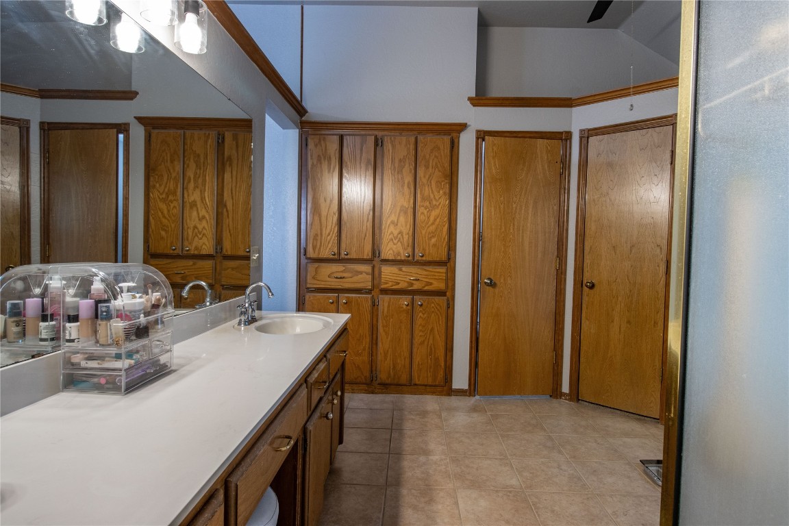 2952 SW 126th Street, Oklahoma City, OK 73170 bathroom featuring ornamental molding, oversized vanity, and tile floors