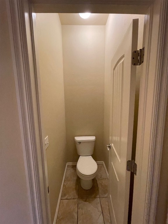 317 Durkee Road, Yukon, OK 73099 bathroom featuring toilet and tile flooring