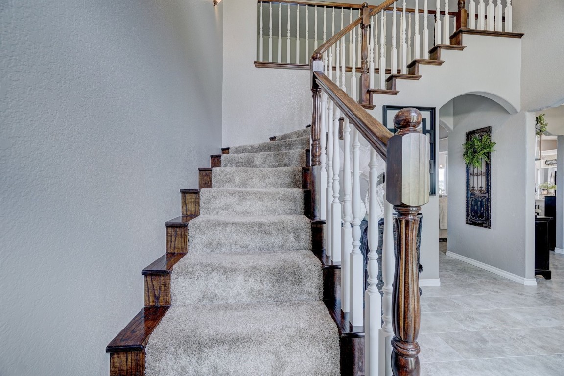 1918 Tyler Terrace, Prague, OK 74864 stairs with tile floors and a towering ceiling
