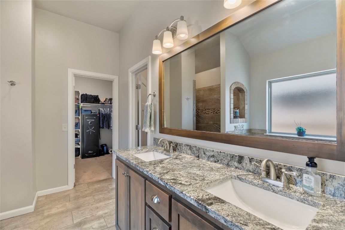 10821 NW 29TH Terrace, Yukon, OK 73099 bathroom featuring double vanity and tile flooring