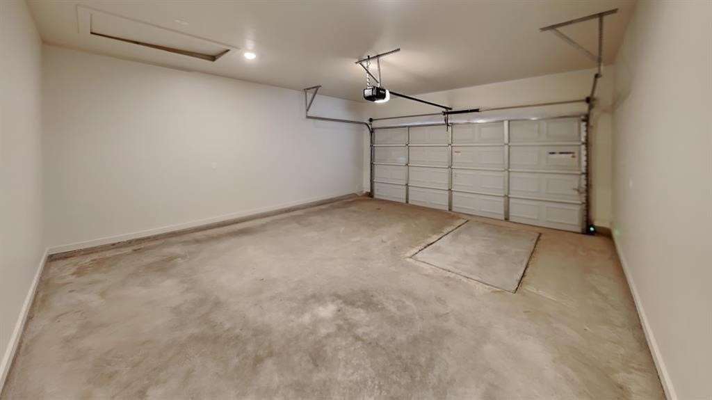 3815 N DIVIS Avenue, Bethany, OK 73008 garage featuring a garage door opener