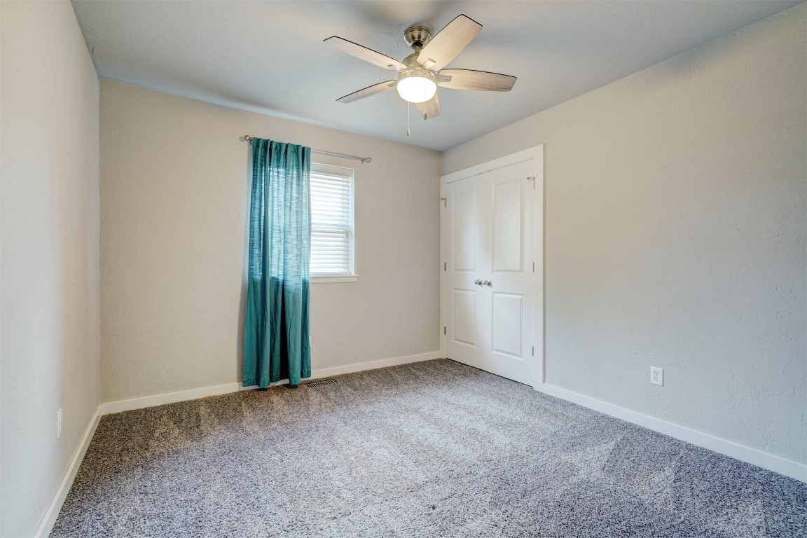 10112 Midfield Cross Street, Oklahoma City, OK 73159 carpeted empty room with ceiling fan