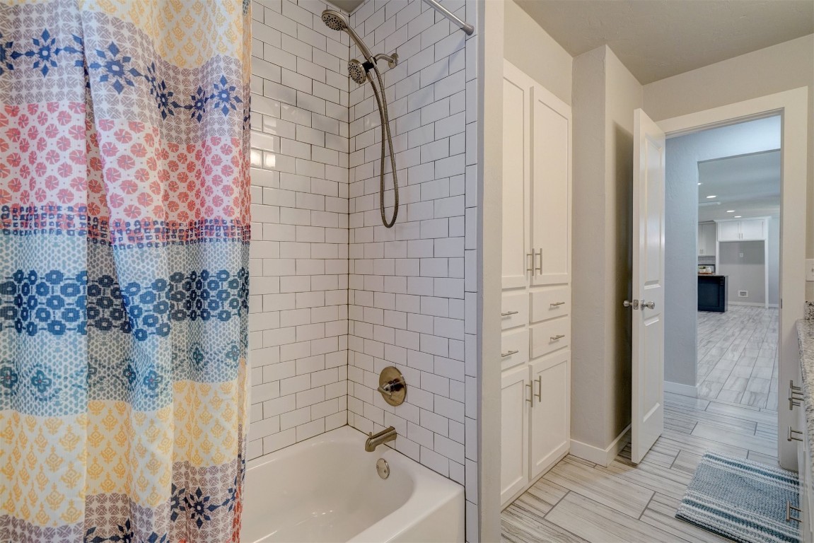 10112 Midfield Cross Street, Oklahoma City, OK 73159 bathroom featuring tile flooring and shower / tub combo with curtain