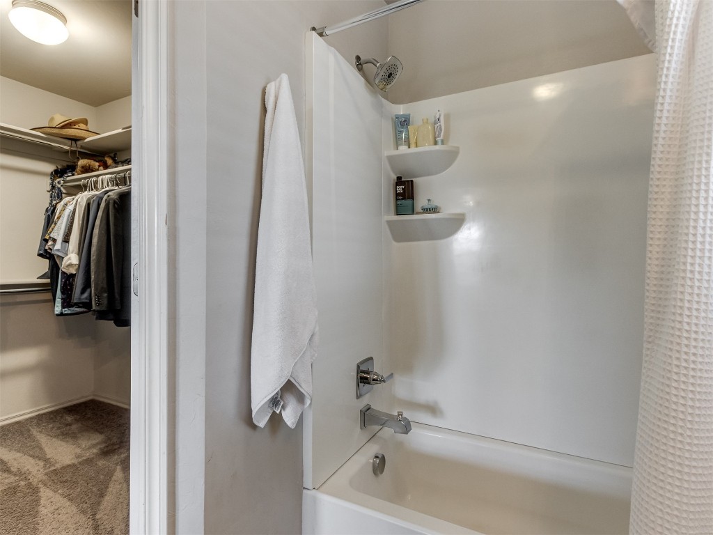 13313 Watson Drive, Piedmont, OK 73078 bathroom featuring shower / bath combination with curtain