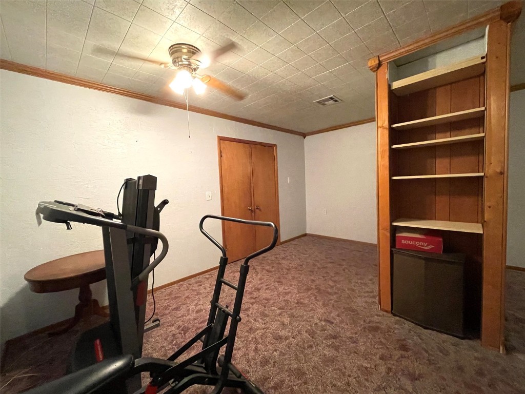 5324 S Agnew Avenue, Oklahoma City, OK 73119 exercise area featuring ornamental molding, carpet flooring, and ceiling fan