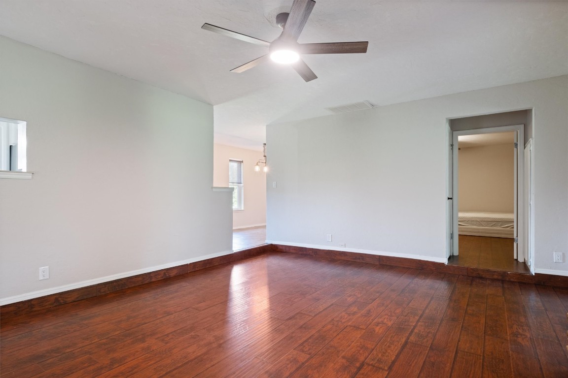 2340 S Rockwell Avenue, Newcastle, OK 73065 unfurnished room with ceiling fan and hardwood / wood-style flooring