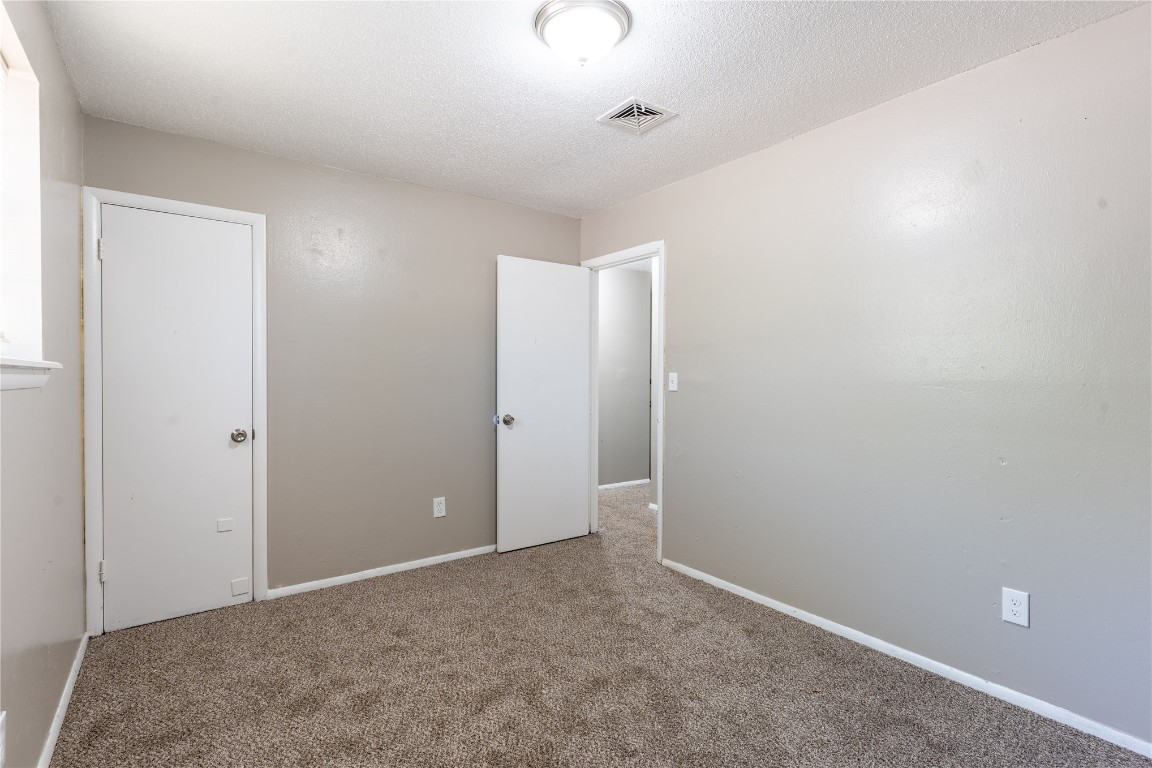 1600 Cynthia Drive, Oklahoma City, OK 73130 spare room featuring carpet floors and a textured ceiling