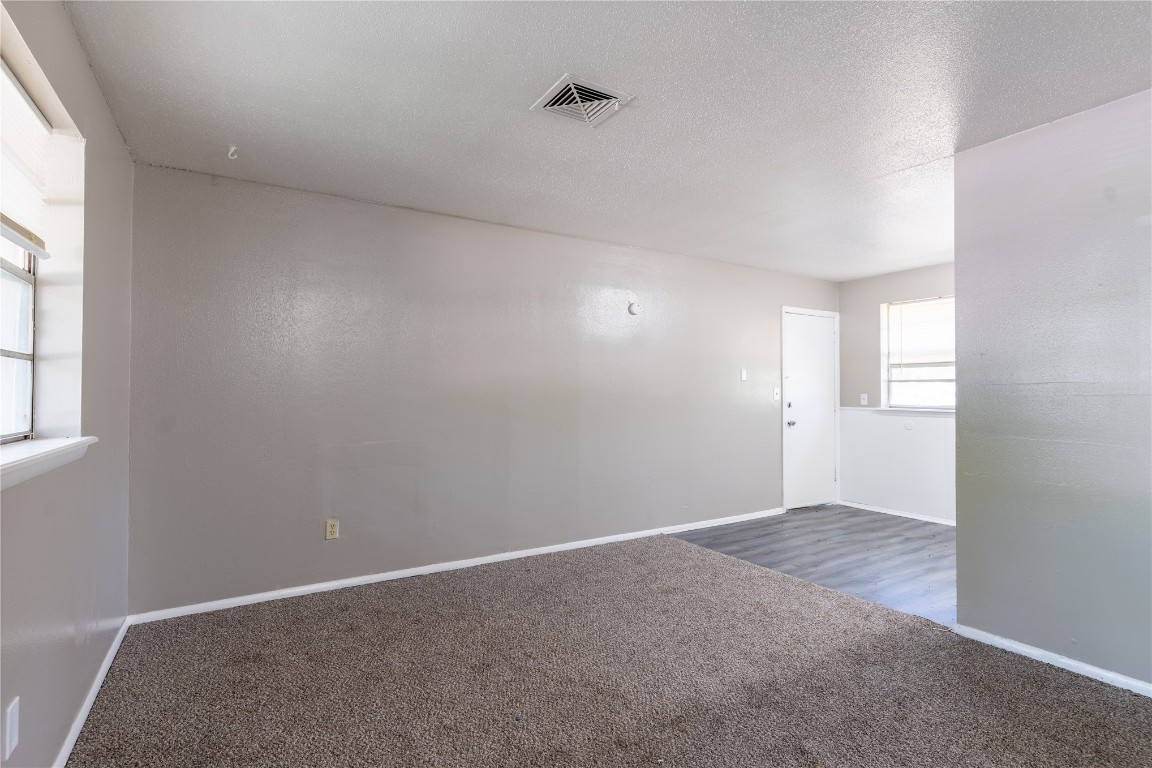 1600 Cynthia Drive, Oklahoma City, OK 73130 carpeted empty room with a textured ceiling