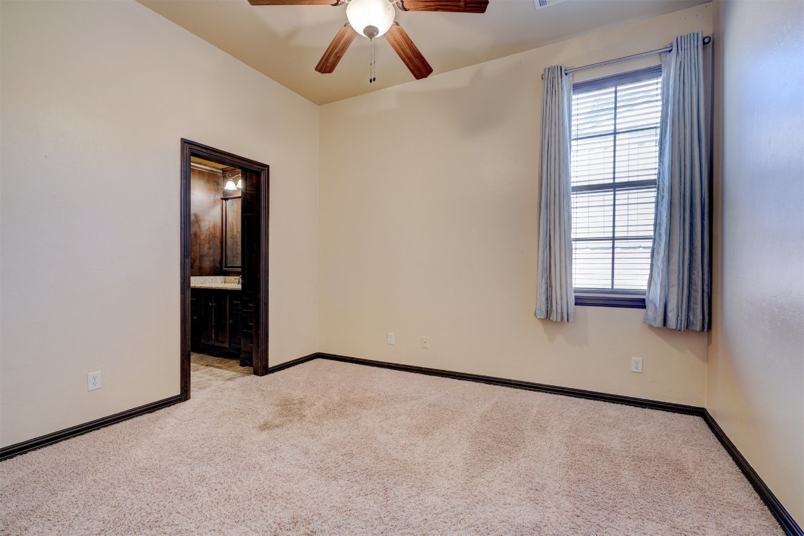 2833 Silvercliffe Drive, Edmond, OK 73012 carpeted spare room with ceiling fan