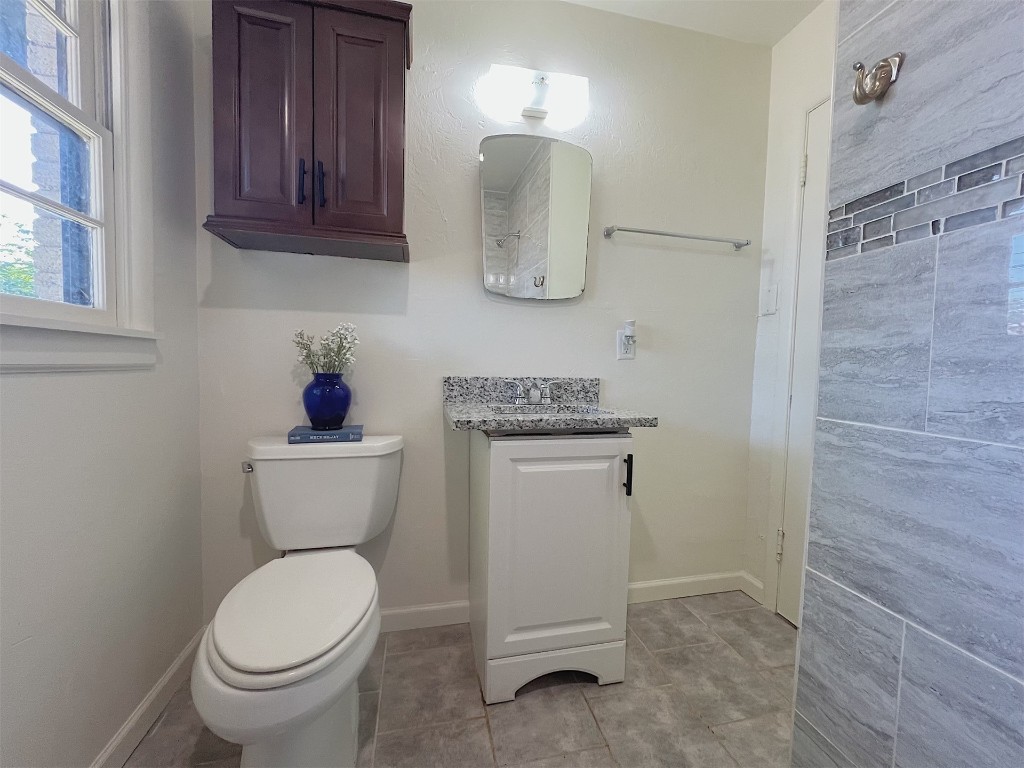 2721 Texoma Drive, Oklahoma City, OK 73119 bathroom featuring vanity, toilet, and tile floors