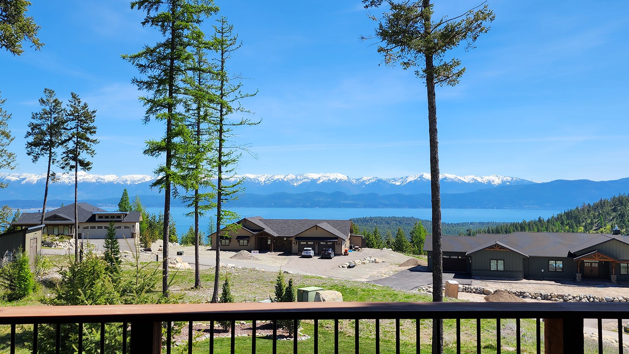 Remarks: Modern appeal to this spacious home overlooking Flathead Lake in the Lakeside Club gated neighborhood. Built in 2016 to take in the spectacular elevated views of the lake and mountains this home has extensive windows to let in light and scenery.  Living space is extended with the ample main floor deck and covered shady patio below. East facing you'll bask in beautiful sunrises and enjoy the alpenglow of the Mission Range at sunset. Home is open concept living with 4 suites (2 on main, 1 is full upper floor, 1 lower) plus exercise room & bonus room with attached full bath that could be for overflow guest or office. Dble garage, beautiful landscaping. Lakeside Club has paved 3376 ft private airstrip, shared hangers.  scenic 9 min drive to Volunteer Park on Flathead Lake, public boat ramp, grocery and restaurants in Lakeside; an hour to Glacier National Park, 40 minutes to Blacktail Mountain Ski area. Contact Scott Hollinger at 406-253-7268, or your real estate professional.