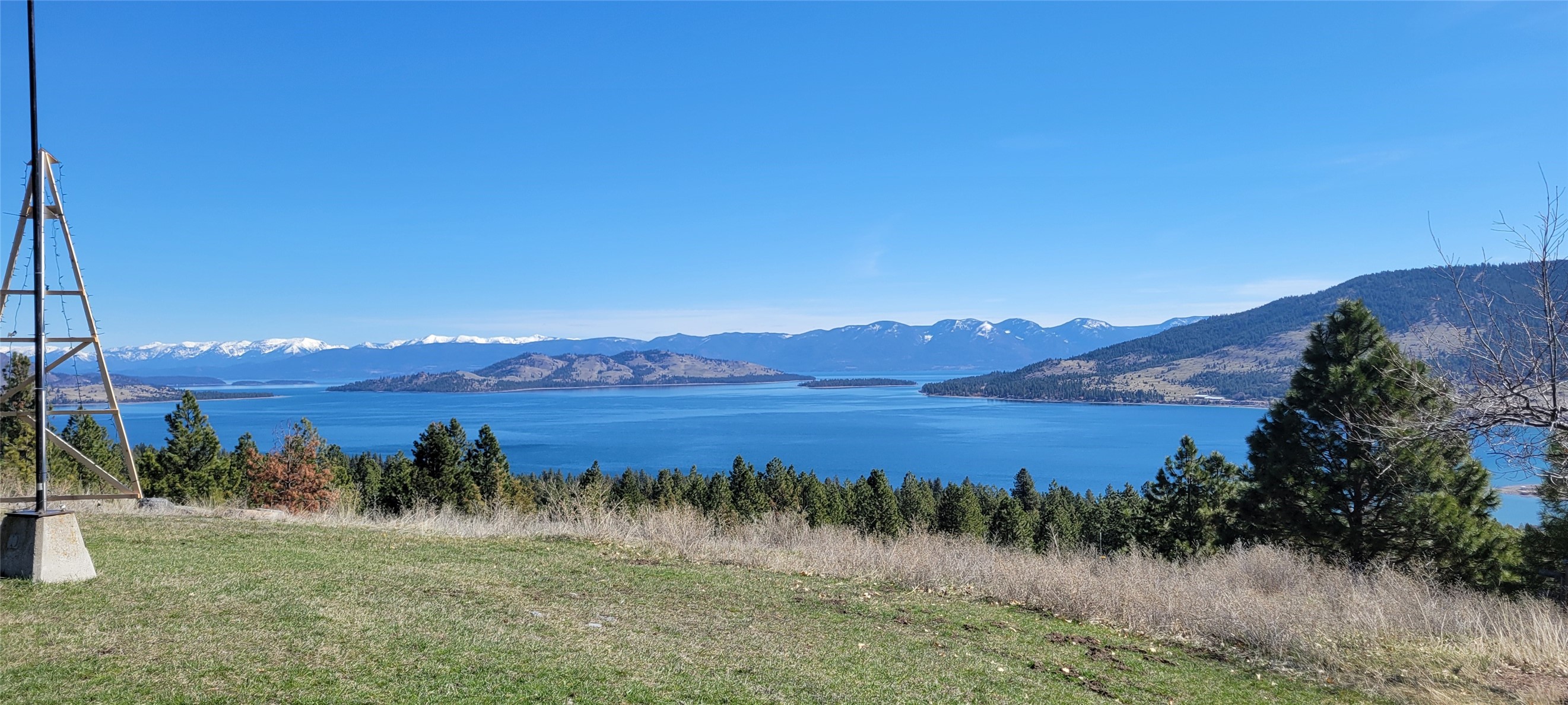 Impressive Million $$ views to Flathead Lake, Wild Horse Island and the mountains! Gently sloping 5 acres, a 2 bedroom 2 bath home of 1280 sq ft.  Main house : wood floors, galley kitchen, dining room, propane stove and a view deck. The property has a 40 X 28  garage/shop with a 3/4 bath, propane heat, electric (metered separate from the house). Keep the apartment above the shop area, recreate as quest house. Shared well with neighbor.  Beautiful place to re create. CCR's historically have been ignored, however several new owners having purchased in the subdivision are interested in governance and the properties conforming. Much information regarding the one bedroom septic permit to be discussed with buyer and seller agents. The CCR's for Early Dawn Estates are provided in the documents tab. The home to be shown by appointment only. The listing information has been collected from out side public and private sources. It is not guaranteed by the listing office or listing agent. Listing office and listing agent make no warranties as to accuracy of information. All interested parties to investigate property to their satisfaction.