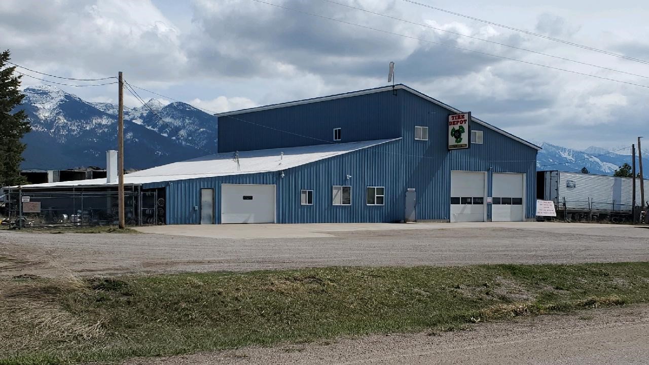 Comprised of 3 distinct parcels, this is locally known as The Tire Depot. A total of 71.57 acres. 
Parcel A is 40 ac. W of Hwy 93 with 680+/- ft. of Frontage on the highway. This has high gravel content with 26+/- ac. now a pit being approved for tire refuse where gravel has been removed. 14+/- ac. is level and immediately available for development.
10.9 ac. just E. of HWY 93 on the Frontage Rd. This has an 8050+/- sq. ft. shop/office with good highway visibility. Currently used as a used tire repair & retail shop with stored whole & shredded tires. Pit currently filled to capacity with mostly shredded tires.
20.67 ac. just E. of the Tire Depot Store, accessed off the Frontage Rd. This has a 15,000+/- sq. ft. shop with drive-thru capacity for semi-truck & trailers. This has an overhead conference room & lower area lunch room & bathroom. A huge, covered area with concrete floor lies adjacent. Buy any of 1, 2, or all 3 parcels for countless options & potential uses. Call Steve Stelling, Sr. cell: 406-544-9029, Stephen Stelling, Jr. cell: 406-360-9308 or your real estate professional.