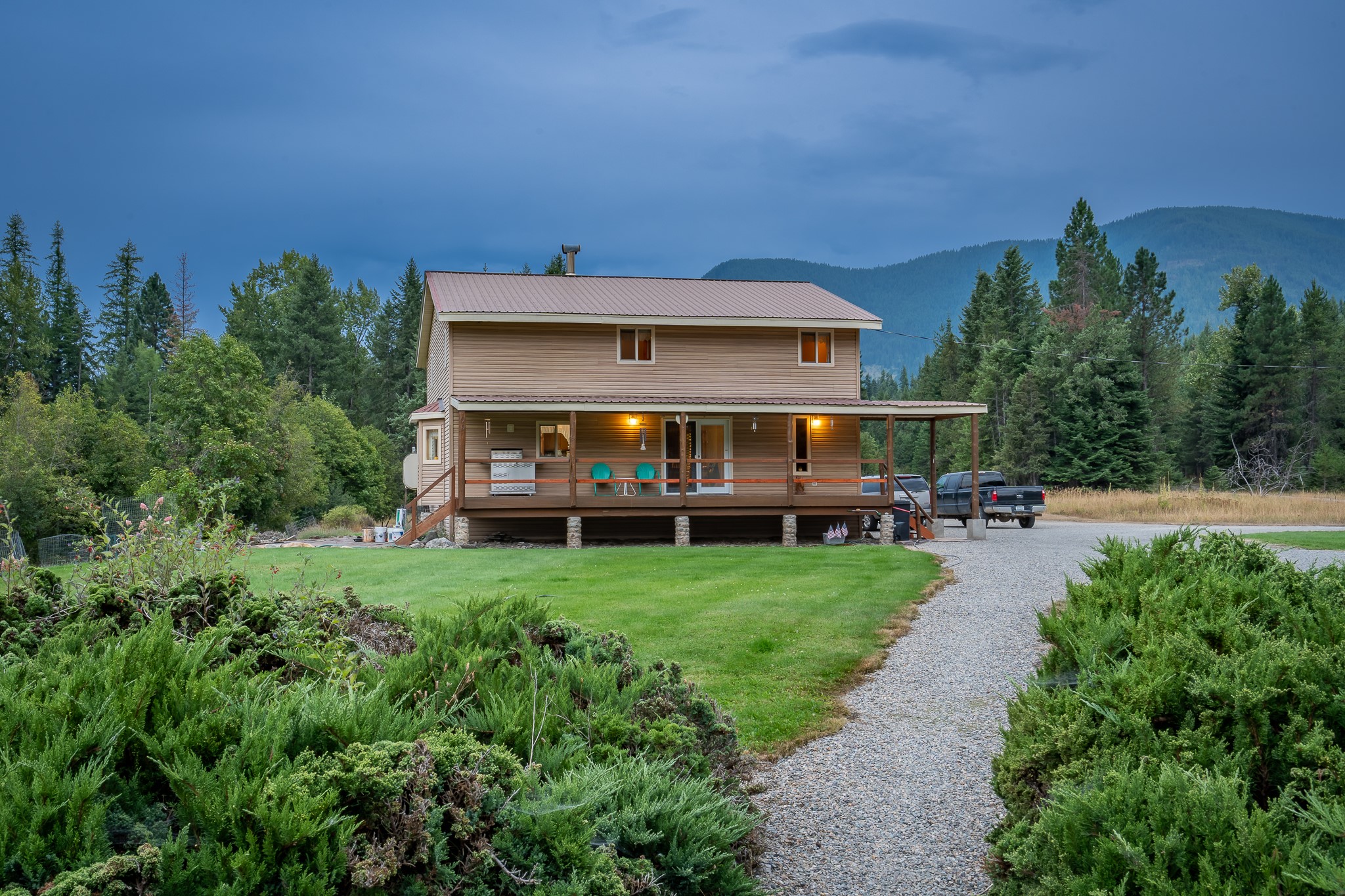 extraordinary piece of paradise nestled in the heart of Noxon, Montana. Enveloped by majestic mountains, this idyllic abode offers over 2,000 square feet of open-concept living space where natural beauty meets modern convenience.As you step outside, you're instantly greeted by the calming melodies of Pilgrim Creek, meandering peacefully through your backyard. This serene setting provides a tranquil backdrop for relaxation and contemplation, as well as a natural playground for fishing enthusiasts. The area is renowned for its abundant trout population, making it a haven for both novice and seasoned anglers alike.For those who fancy a more active lifestyle, the surrounding wilderness is perfect for hunting and hiking, encapsulating the raw and untouched beauty of the Montana landscape. Just a short stroll away, you'll find the Cabinet Gorge Reservoir and community parks, popular destinations for boating, swimming, and picnicking.This property is uniquely positioned for prospective buyers with a passion for the great outdoors. The home is sold in conjunction with a well-established outfitting business known for its high-quality outdoor adventures. This opportunity provides a seamless integration of work, play, and relaxation—truly embodying the Montana lifestyle. Situated just a scenic drive away from the vibrant Sandpoint area, you'll have easy access to the largest lake in Idaho, Lake Pend Oreille. Here, you'll discover a variety of recreational activities from boating and fishing to water skiing and kayaking. This stunning locale is also home to various events, restaurants, shopping, and cultural attractions, providing a balance of outdoor exploration and urban amenities.
Whether you're seeking a peaceful retreat, an outdoor adventure hub, or a business opportunity in the heart of Montana's wilderness, this property offers it all. Experience the tranquil rhythm of life in Noxon, where the mountains meet the sky, and every sunrise is a promise of a new adventure.

This property is to have a new boundary line adjustment to survey out home, or can be sold with entire business and structures.  List price is for home only.

Call Diane Westrum  406-897-4172 or your real estate professional