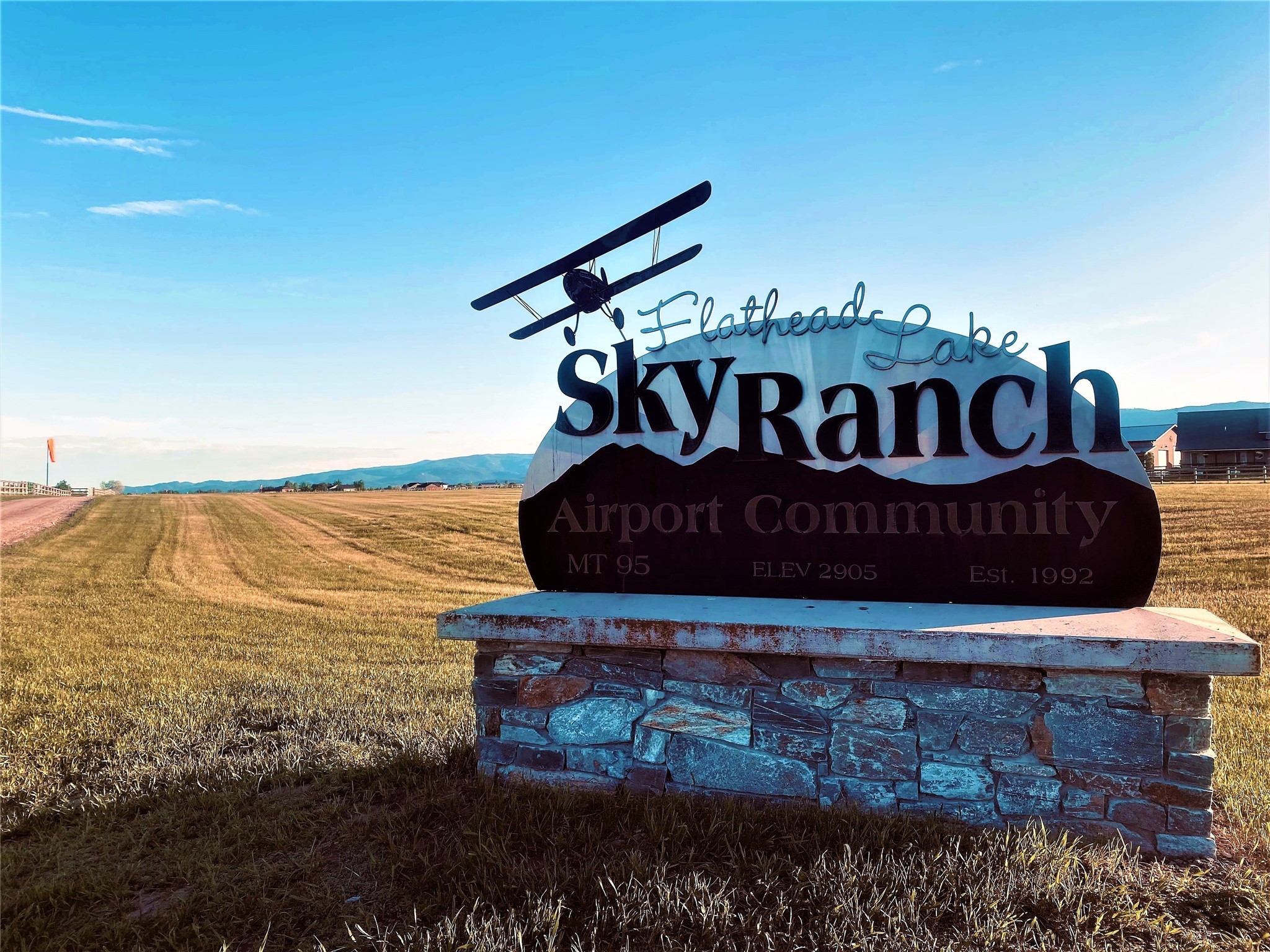 Fantastic soft field airstrip lot in the Sky Ranch neighborhood, Rotor Wing. This 5.03 acres has amazing 360° views of the Swan and Blacktail Mountain ranges. Private Sky Ranch runway offers remarkable approach and take off north/south over Flathead Lake. Beautiful level ground is perfect for your fly-in dream come true home, with breathtaking views and very convenient location! This would also be a great horse property, with clean and green acreage. Runway is 5000x120 feet/1524x37 meters with non-standard runway edge lights. Lower Valley is a short and convenient drive to Bigfork (10 minutes), Kalispell (20 minutes), Somers, Lakeside (10 minutes). Glacier International Airport is about 35 minutes' drive, and Glacier National Park is about an hour. Come enjoy all that northwest Montana has to offer, from the best recreation areas and wildlife, stunning big skies for flying, and a lovely neighborhood with fellow enthusiasts. Welcome to the Flathead Valley, renowned for its beauty and recreation!  Flathead Lake is just a short drive away from the Sky Ranch neighborhood, and is the largest freshwater lake west of the Mississippi.  This lake is a marvel, with crystal clear waters and incredible recreation opportunities, including great fishing. Nearby is the Jewel Basin Recreation Area, with year-round outdoor fun!  Great hiking, cross-country skiing, snowmobiling, horseback riding, and a fantastic array of wildlife viewing- these are just a few of the opportunities for a healthy lifestyle that never gets old.  The Eagle Bend Golf Course is about ten minutes away, and is a lovely Jack Nicholas 18 hole course. There's so much to do and see here in the Flathead Valley; it's a wonderful place to live, work, and play.