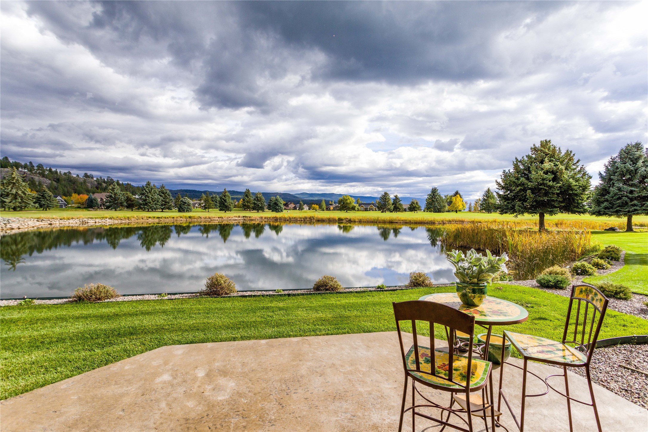 A wonderful two-story townhome overlooking the pond & the 8th fairway on the Osprey 9 at the Eagle Bend golf course. The patio & guest room balcony capture the views of the Mission Mountains to the southeast & Flathead Lake to the south. The spacious kitchen connects to the dining room, which opens to the comfortable living room with a cozy corner fireplace & expansive sliding doors to the patio bordering the pond. The main floor consists of the primary suite with soaking tub, separate shower & walk-in closet; the laundry room is connected to the over-sized double garage & convenient to the adjoining powder room. The upper-level features two guest suites, one with a viewing balcony & the other with a huge storage closet, separated by the loft office.  Most of the furniture can stay. Contact Tom Brown 406.471.0630 or Katie Brown 406.253.3222 or your real estate professional. The residence is located only minutes from the Eagle Bend clubhouse, the Eagle Bend Yacht Harbor, the Montana Athletic Club & the quaint village of Bigfork. Glacier International Airport & Glacier National Park are within an hour away.