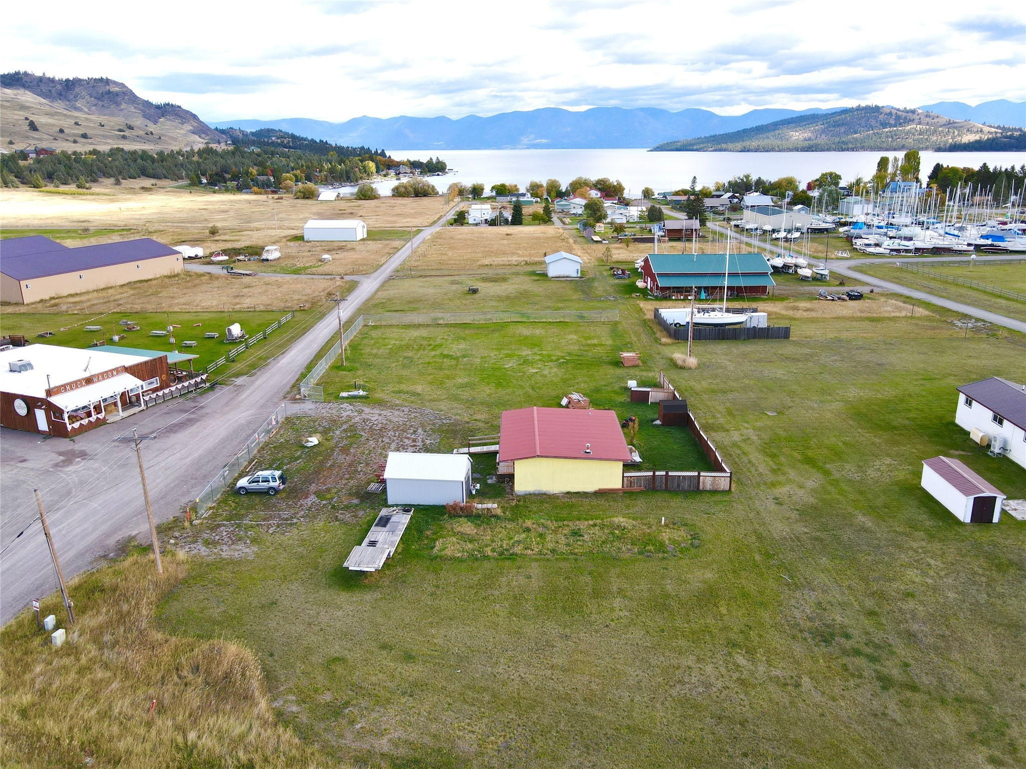 A GEM IN THE ROUGH.  Come make your lake life a reality in the heart of Dayton on the west shore of Flathead Lake! With just under 1 acre of land come build your forever or vacation home while living in the existing 716 sq ft dwelling.  With room to build, the possibilities for this property are endless -- build vacation rentals, a shop or a barndominimum.  No zoning or covenants so commercial opportunities may exist.  Within walking distance to the public boat launch and beach, enjoy your days on the water and your evenings taking in the breathtaking sunsets.  Dayton provides the perfect year-round “rural living” opportunity while still being in driving range to Kalispell, Whitefish, Lakeside, Polson and Missoula.  Hit the ski slopes at Blacktail Mountain in less than 45 minutes or take a trip up to Whitefish Mountain.  The property is being sold “as-is”.  

Call Amanda Adams at 406-360-8597 or your real estate professional for additional information to schedule a showing.